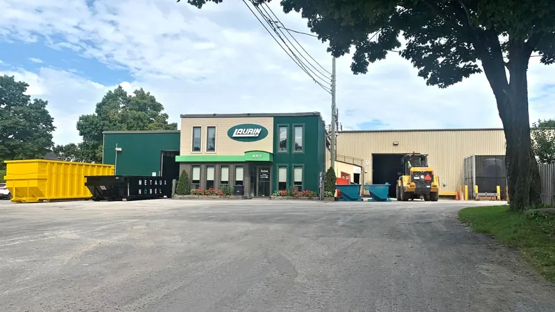 The Laurin plant and offices in Laval, Quebec, with steel containers in the yard